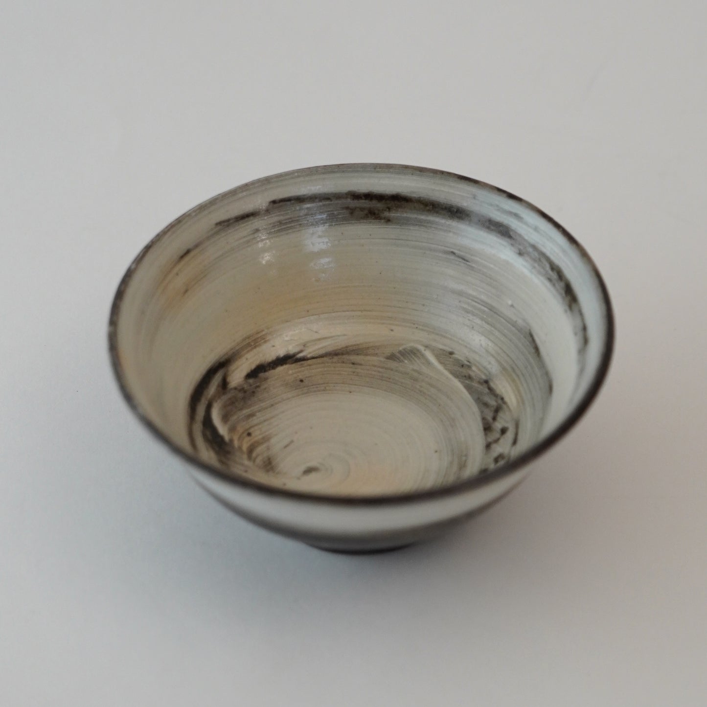 Ceramic bowl with a textured surface on a plain background