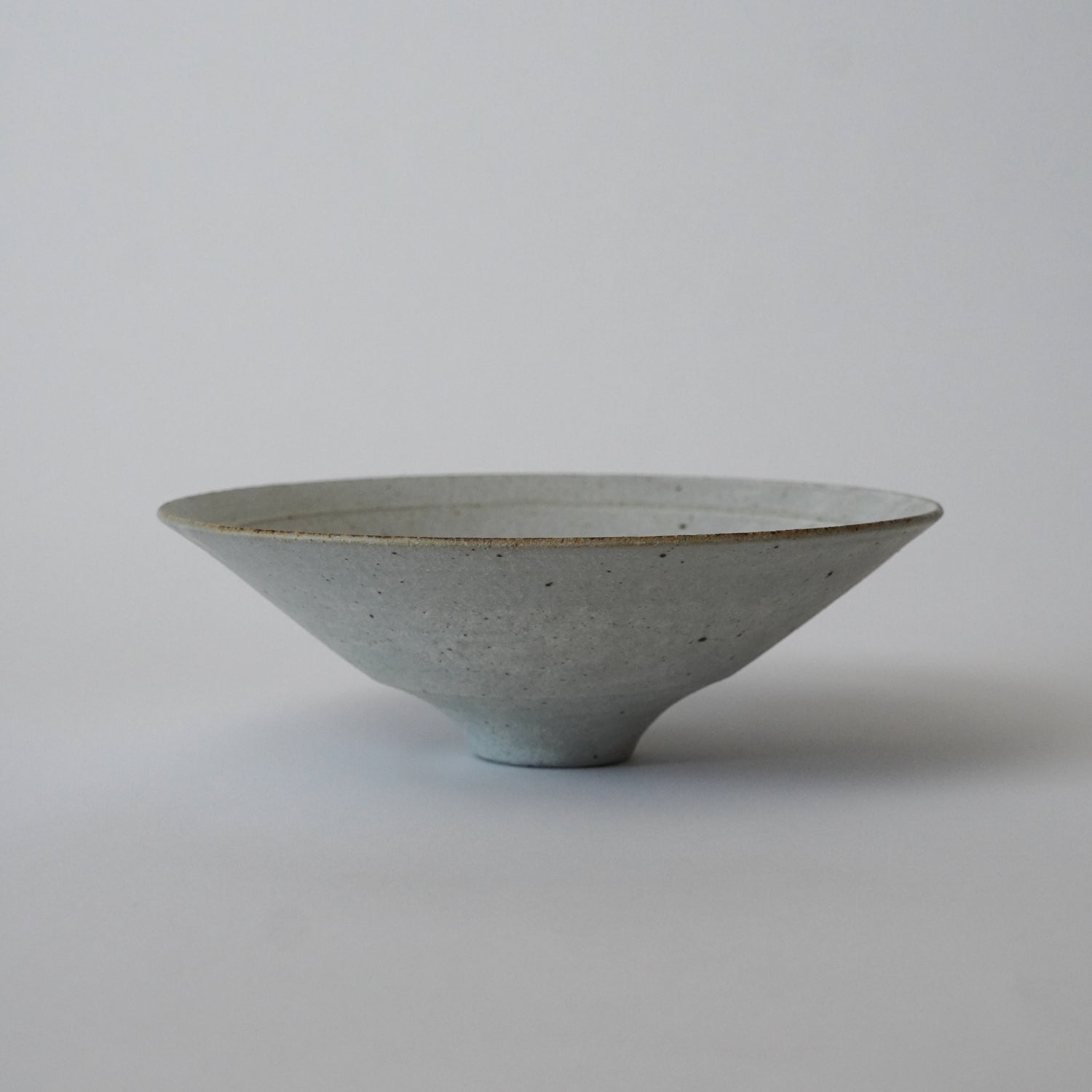 Ceramic bowl on a plain background