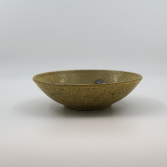 Ash color ceramic bowl on a white background