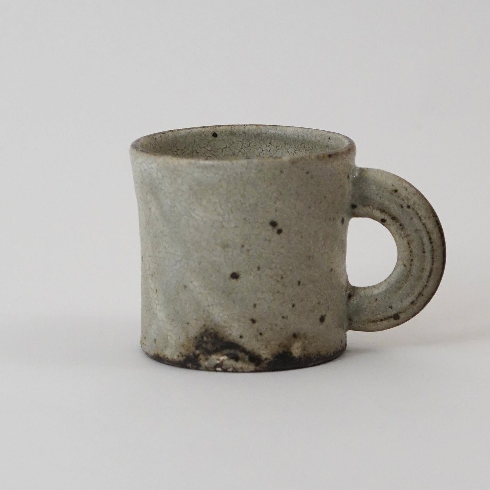  Ceramic mug with a handle on a light gray background