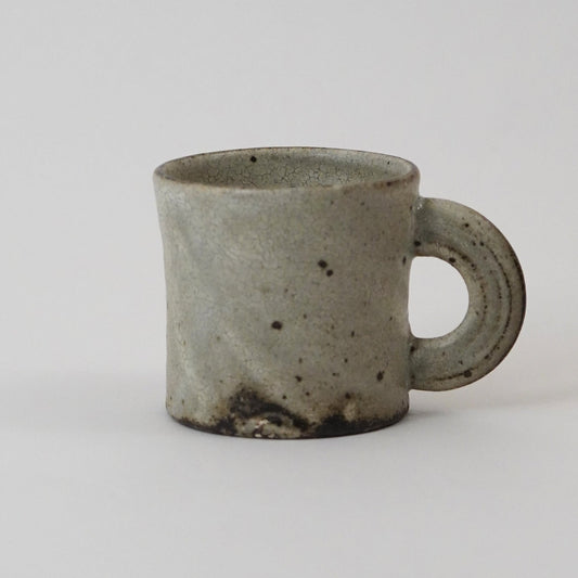  Ceramic mug with a handle on a light gray background