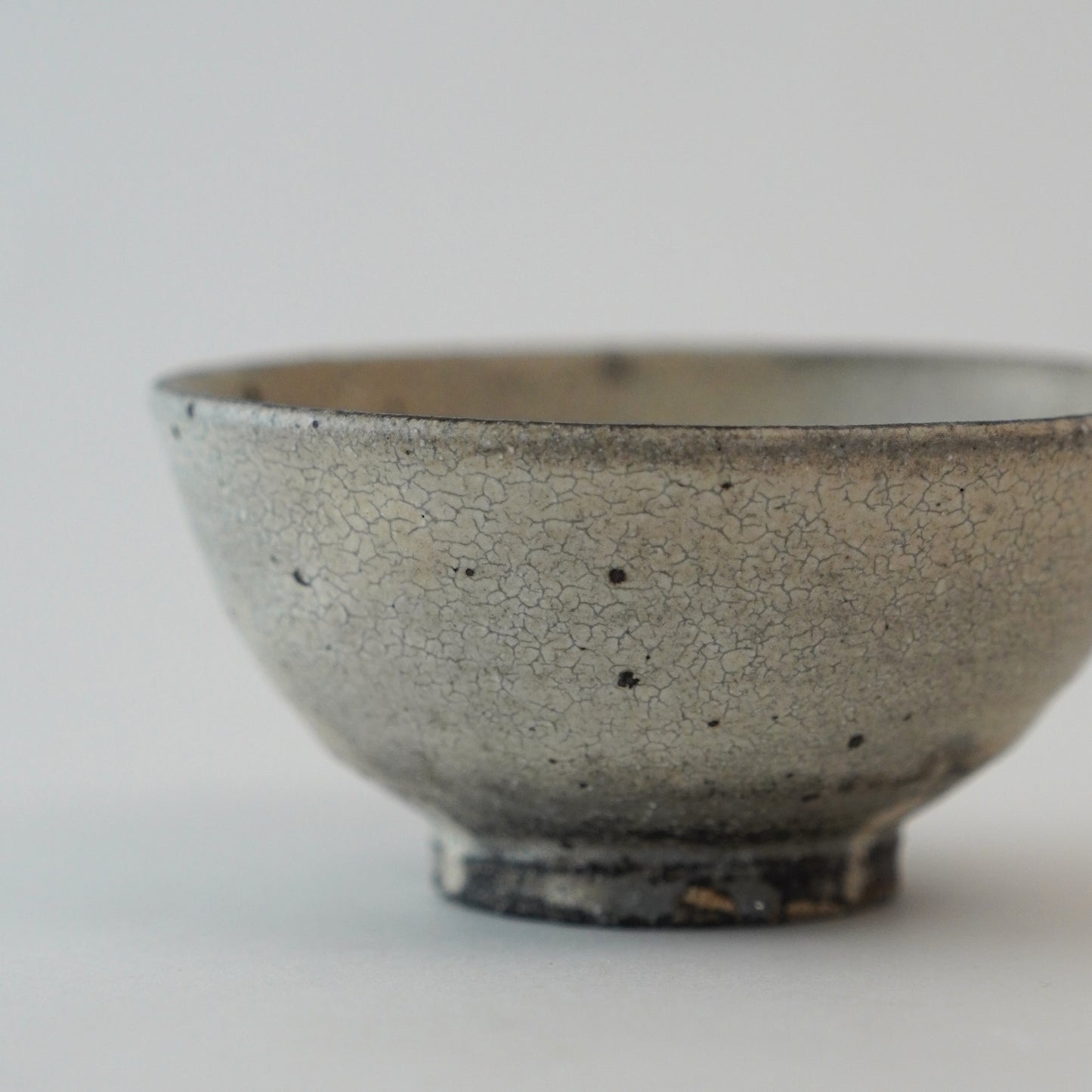 Ceramic bowl with a textured surface on a light gray background