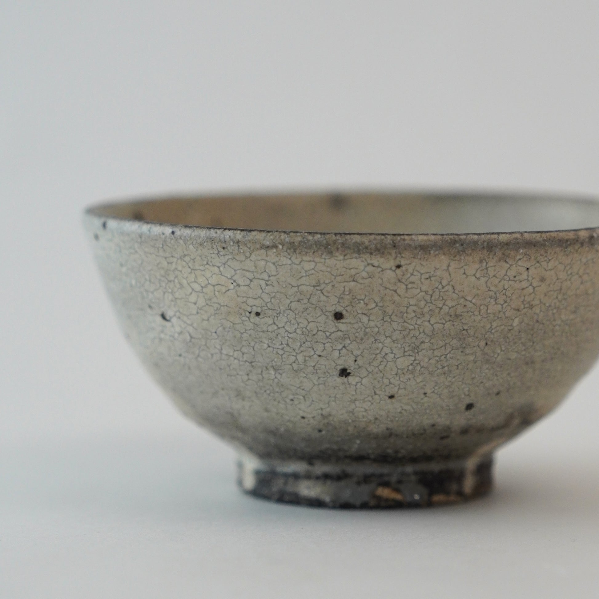 Ceramic bowl with a textured surface on a light gray background