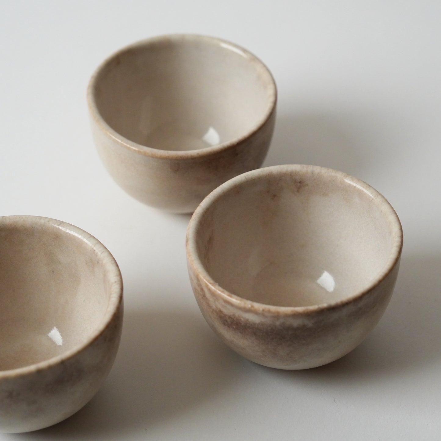Three ceramic bowls on a white background