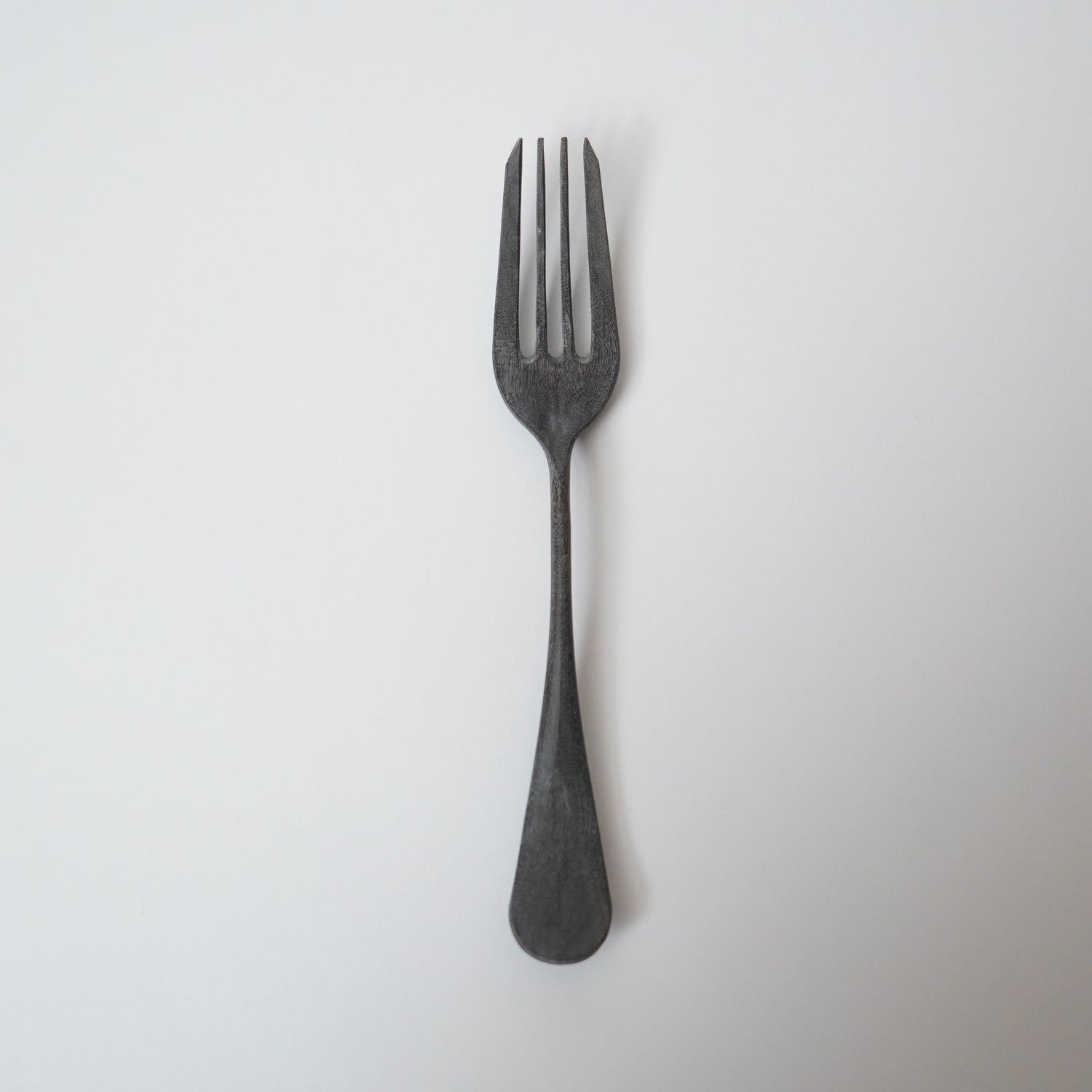 Black fork on a white background