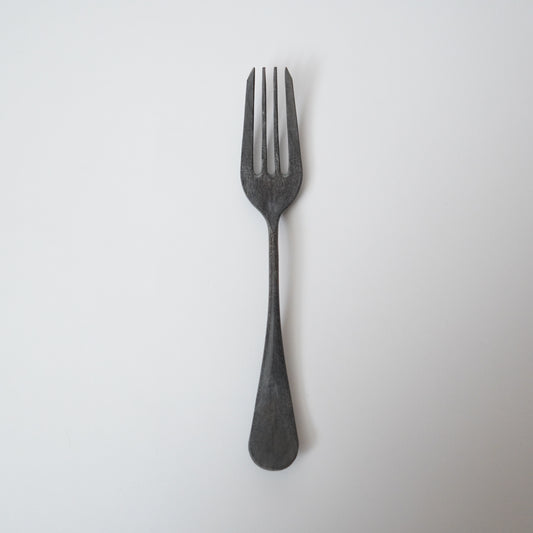 Black fork on a white background