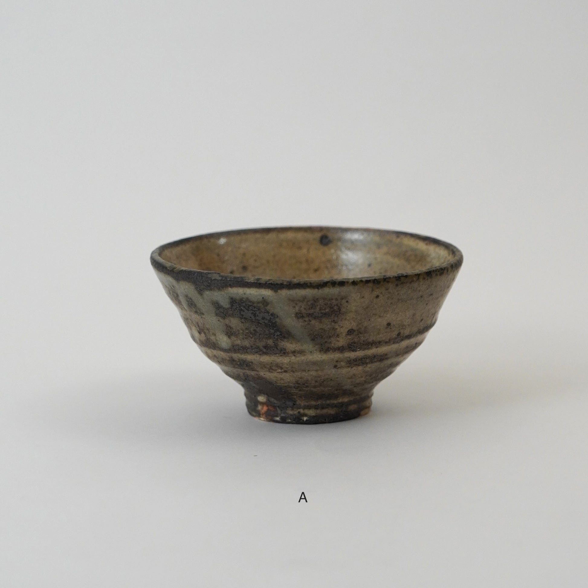 Ceramic bowl with a textured surface on a white background
