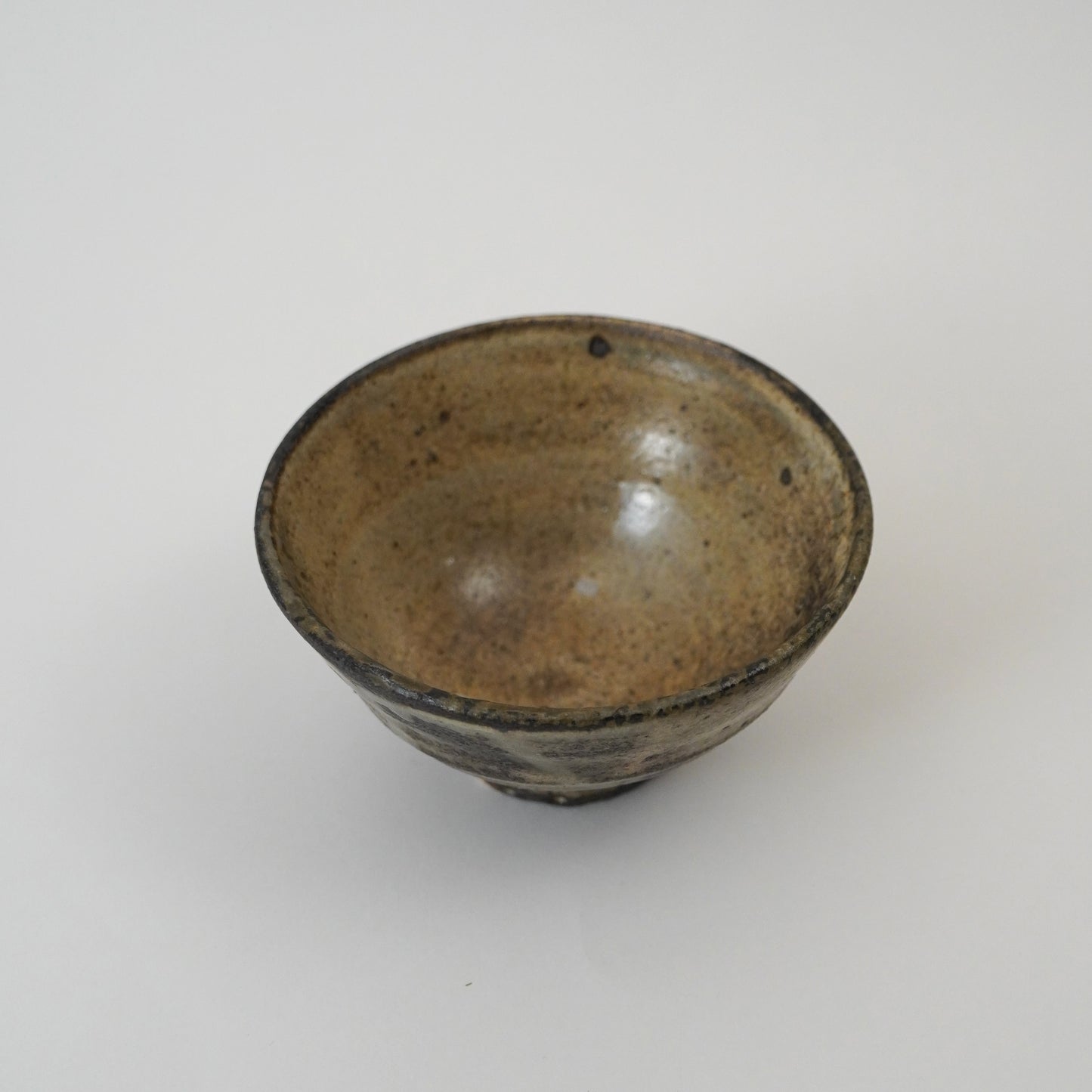 Brown ceramic bowl on a white background
