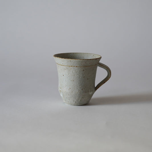 Ceramic mug on a plain background