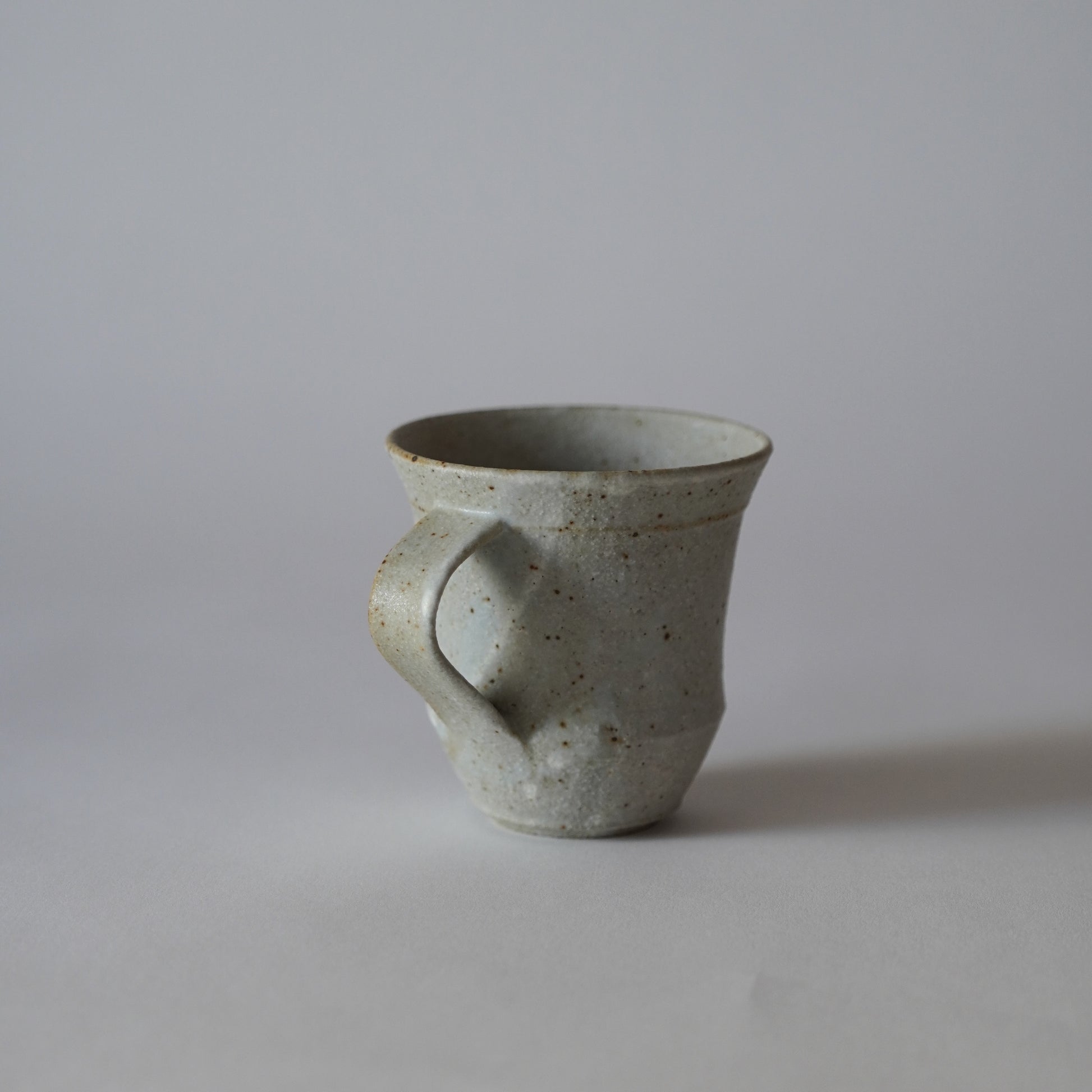 Gray ceramic mug on a plain background