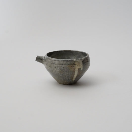 A black ceramic pitcher with a simple, rustic design, displayed against a white background.