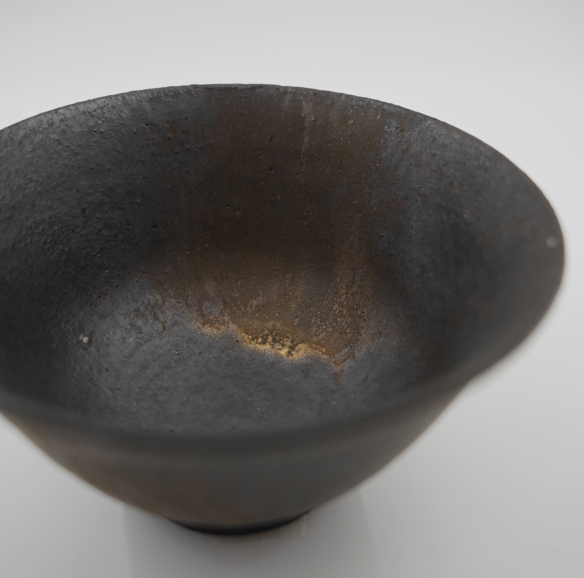 Black ceramic bowl on a white background