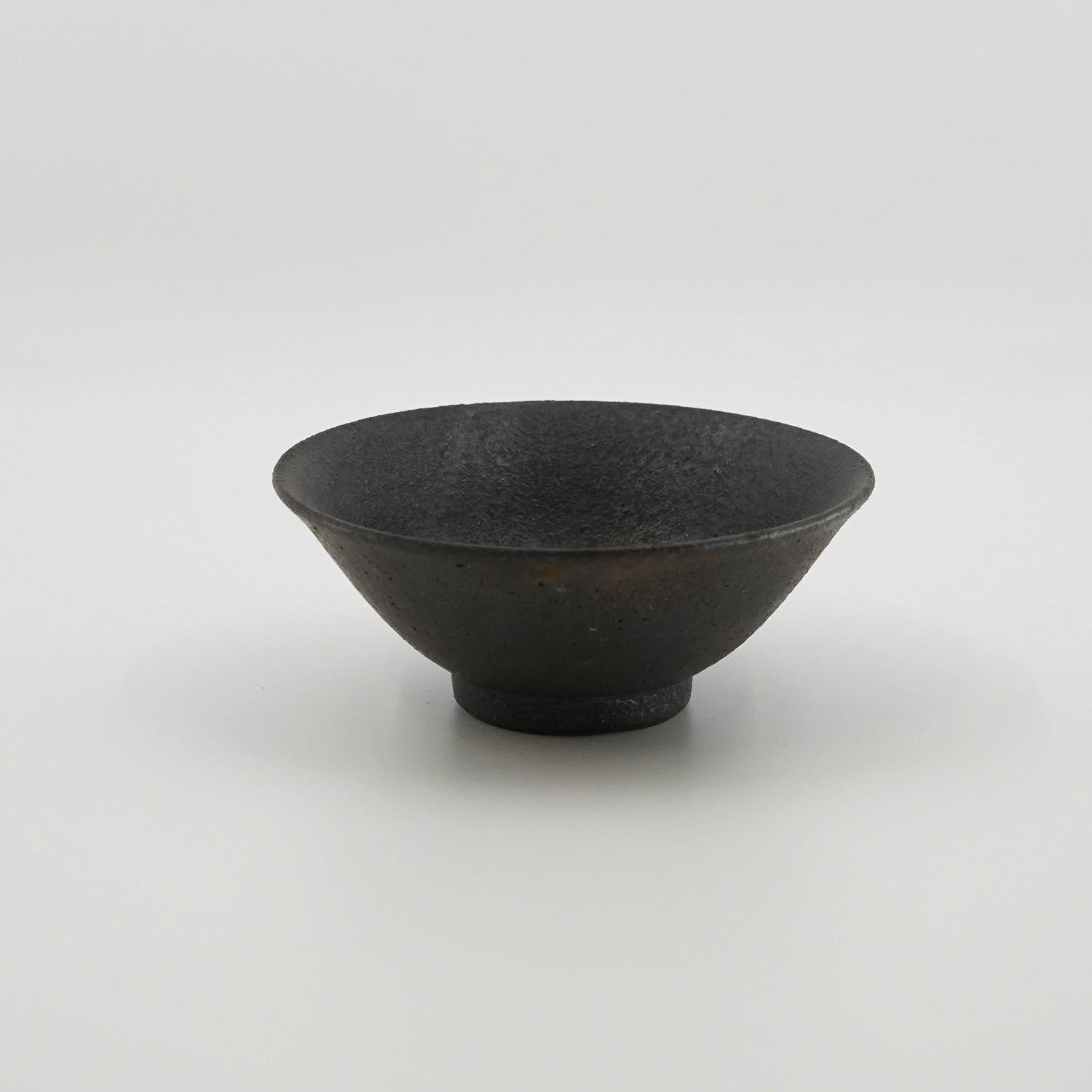 a black color bowl on a white background