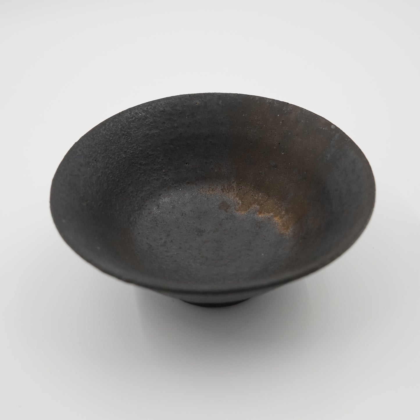 Black ceramic bowl on a white background