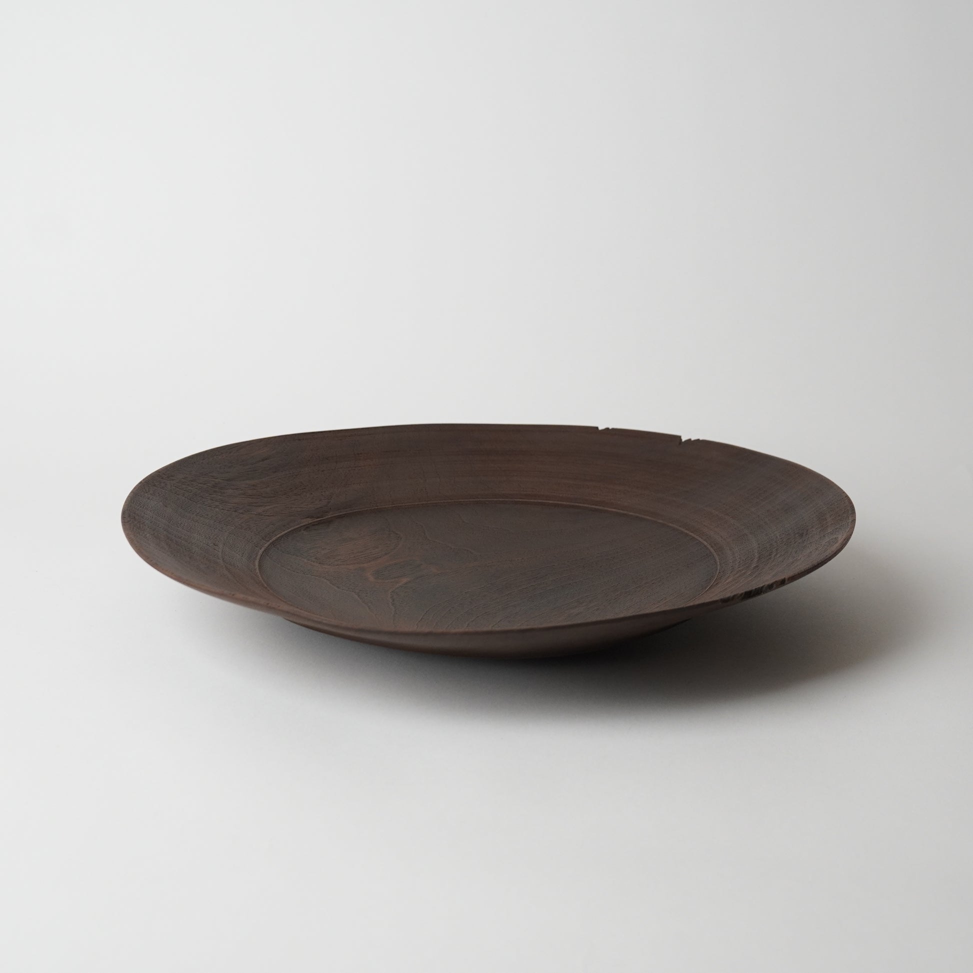 Brown ceramic plate on a white background