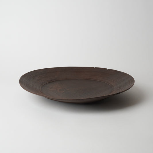 Brown ceramic plate on a white background