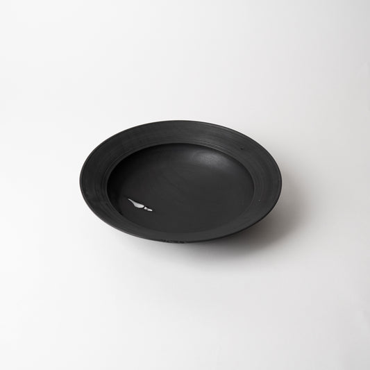 Black wooden bowl on a white background