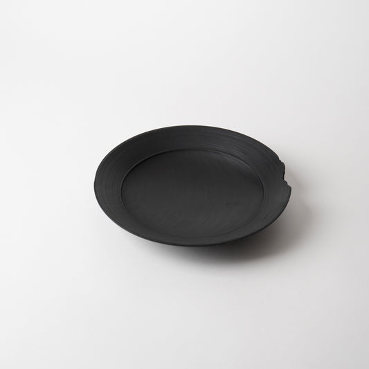 Black wooden  plate on a white background