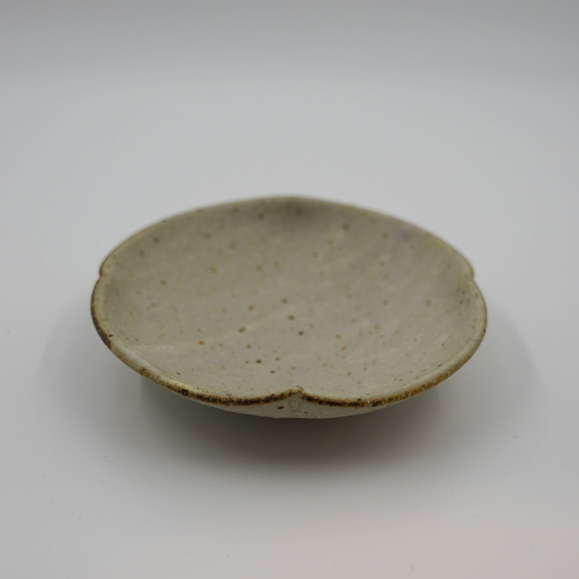 Small ceramic dish on a plain background