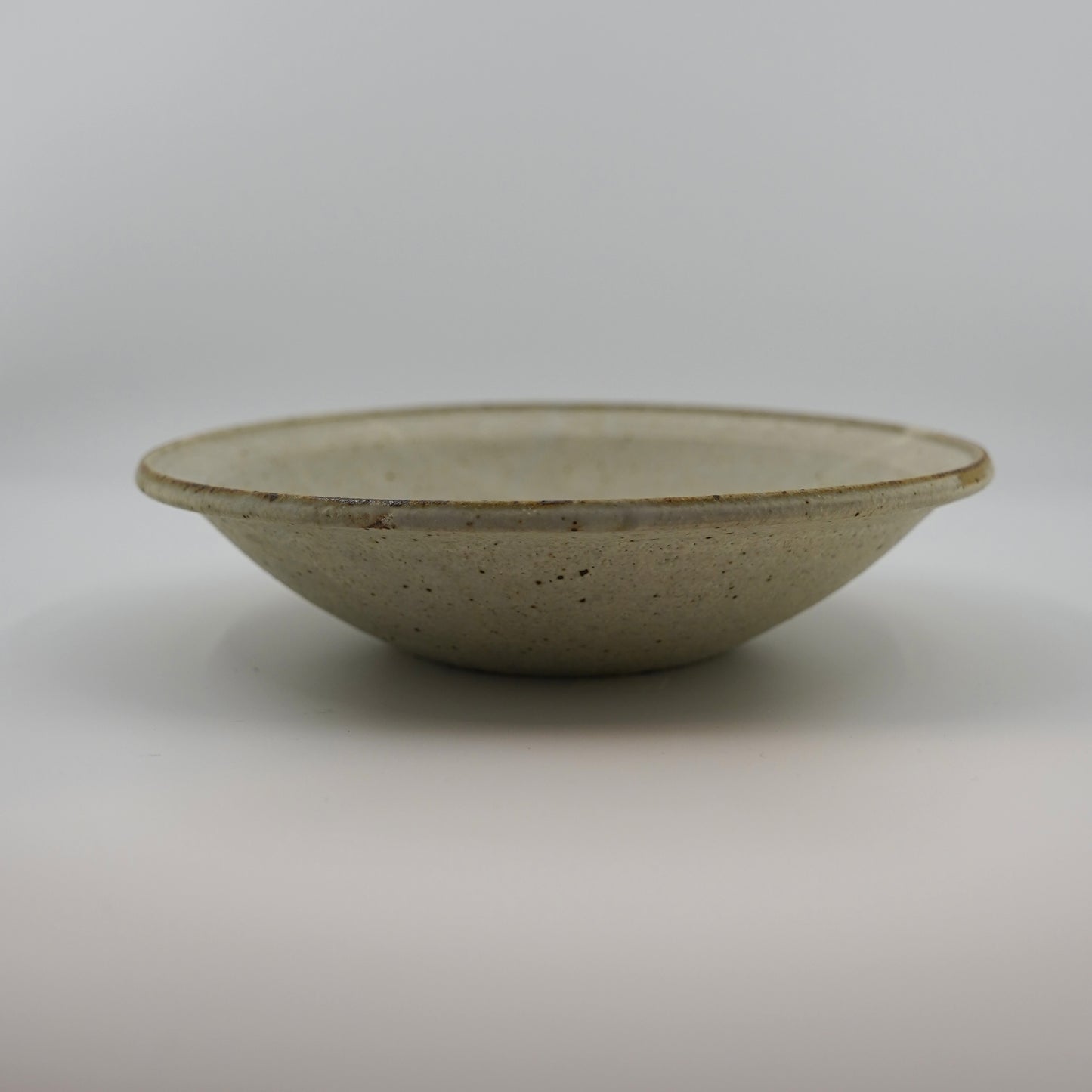 Ceramic bowl on a plain background