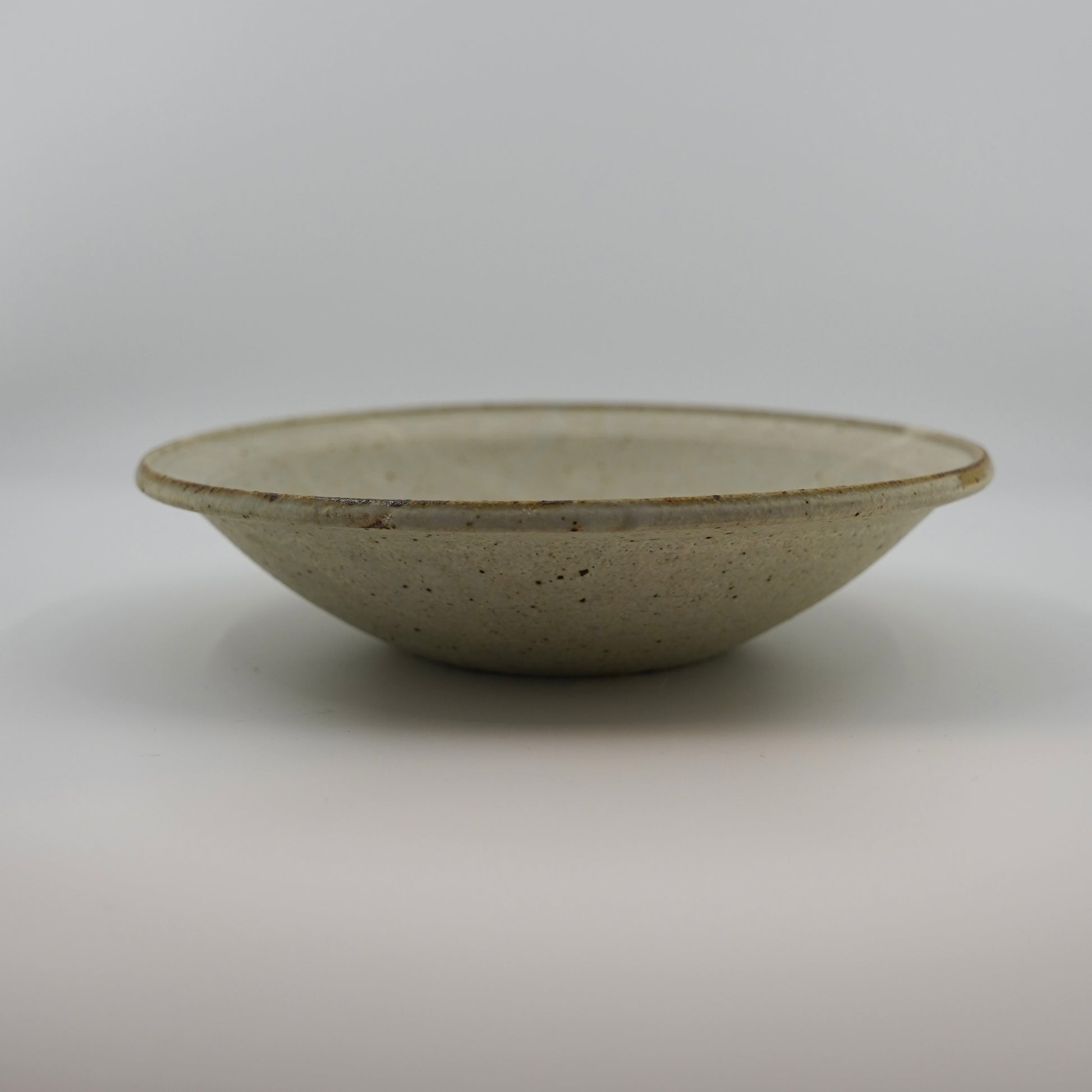 Ceramic bowl on a plain background