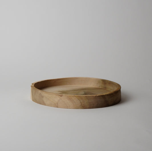 Wooden tray on a light gray background