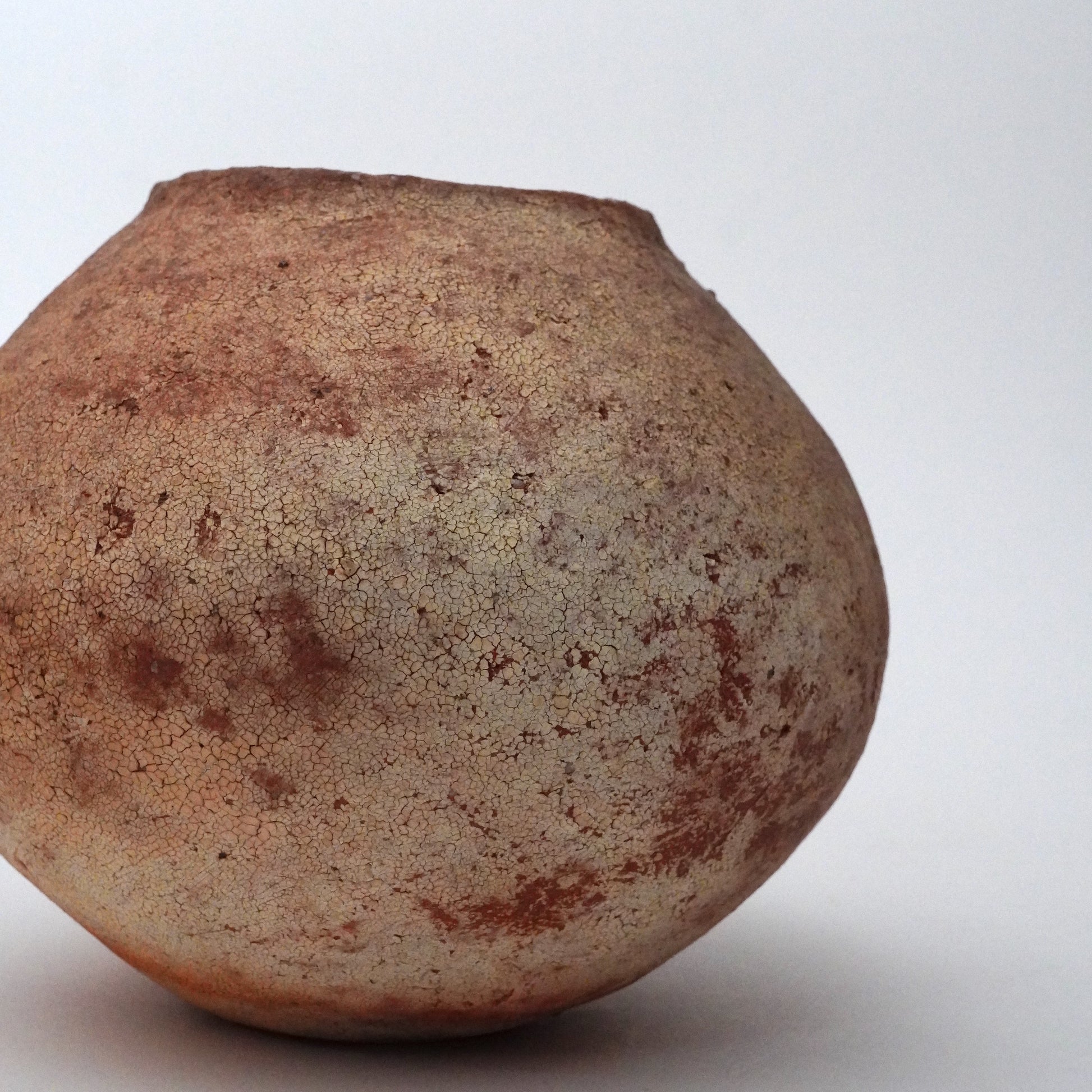 Brown ceramic vase on a white background