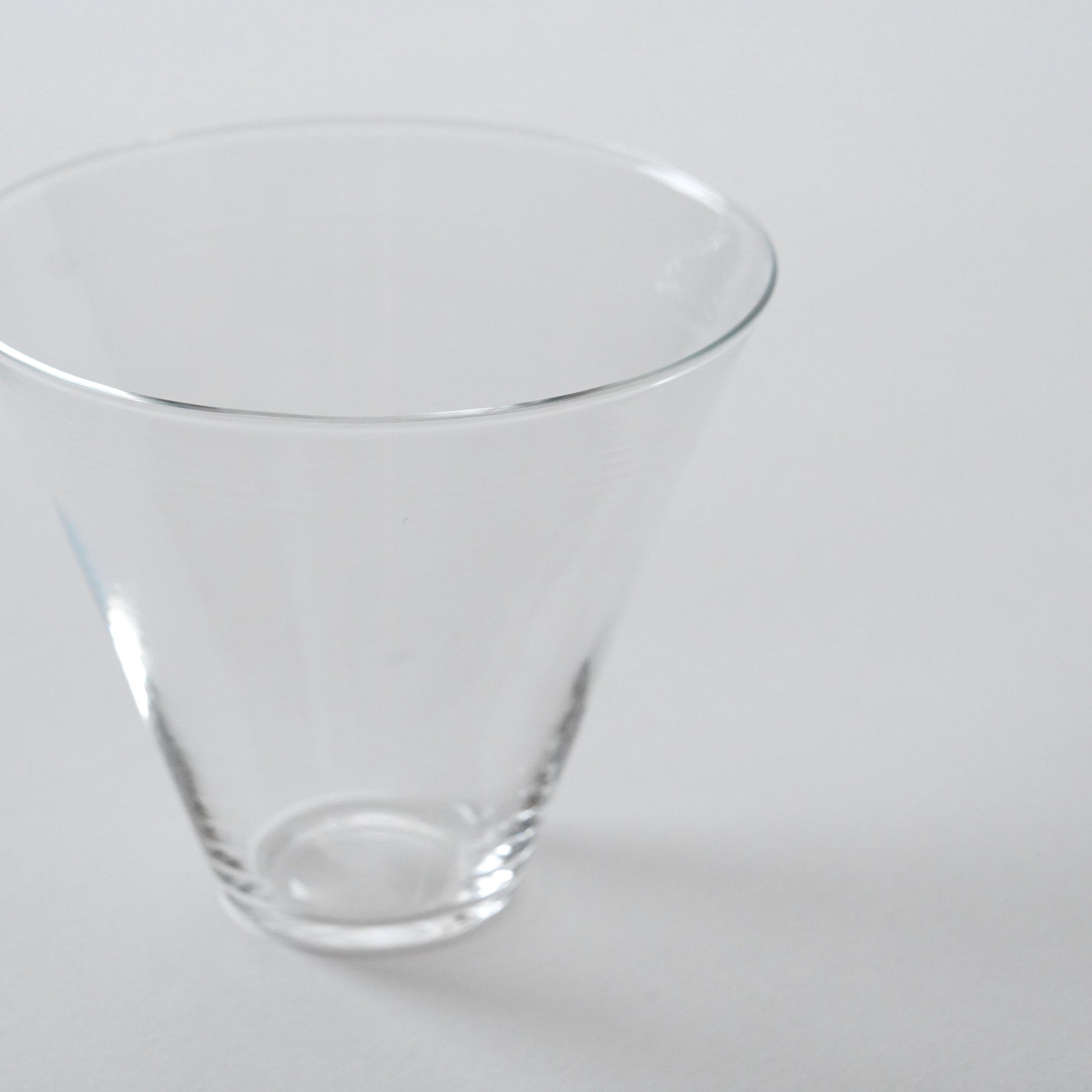 Clear glass cup on a white background