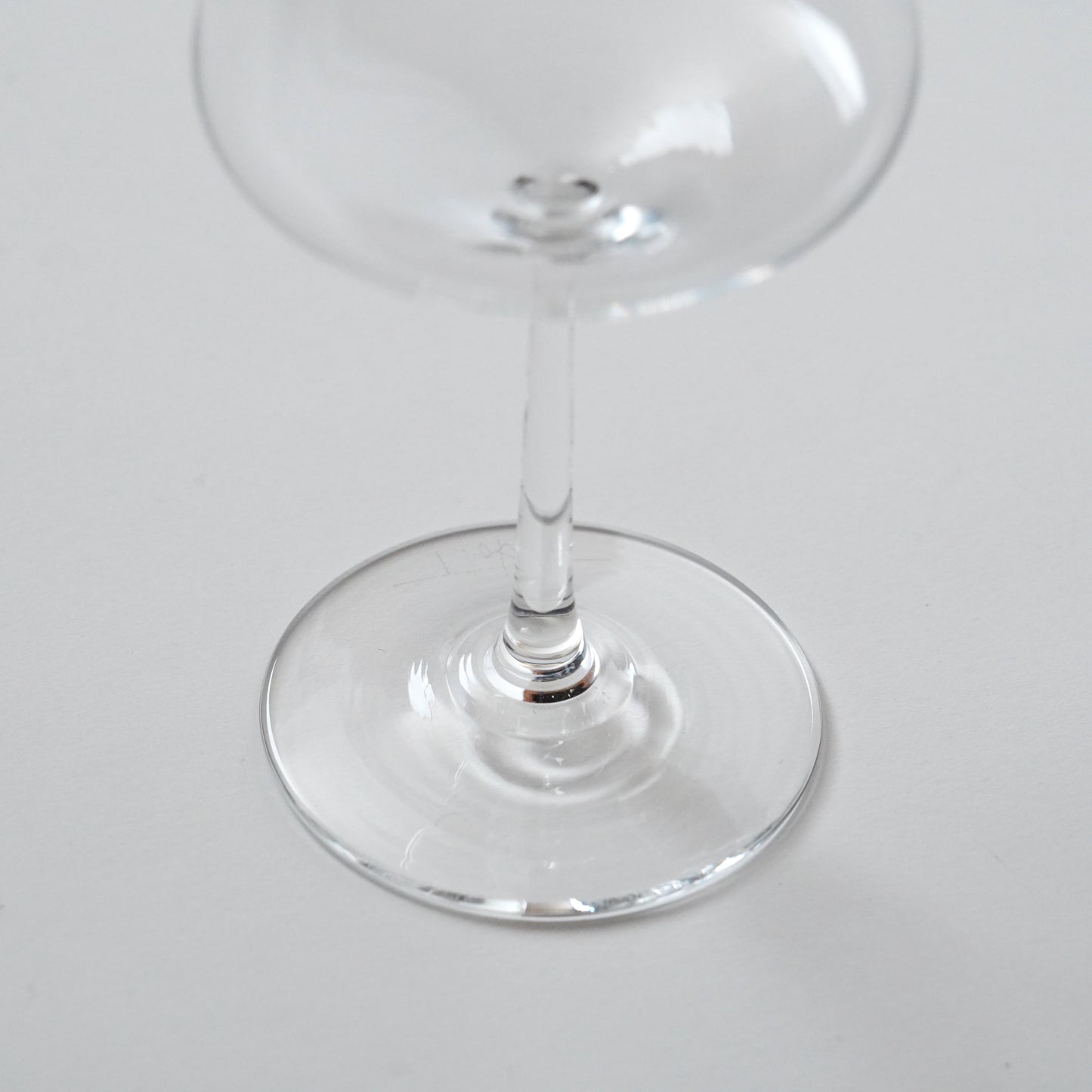 Clear glass wine glass on a white background