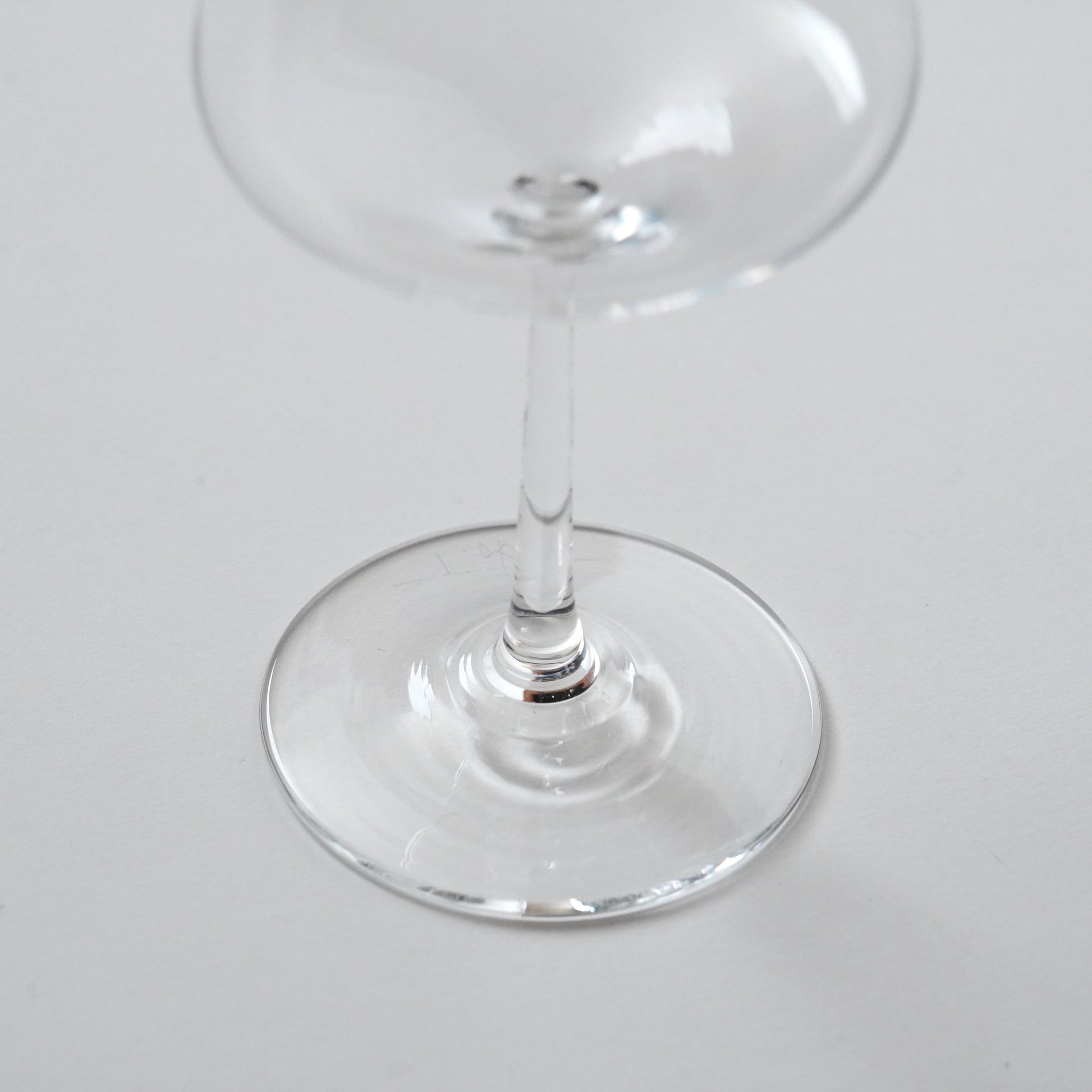 Clear glass wine glass on a white background